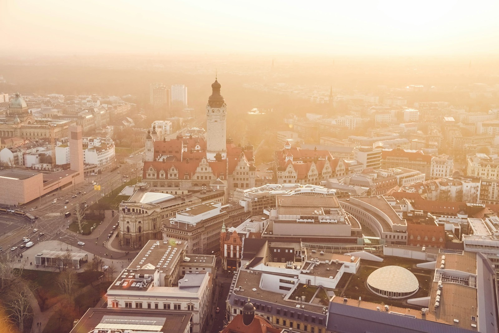 View over Leipzig rooftops and church towers in warm evening light