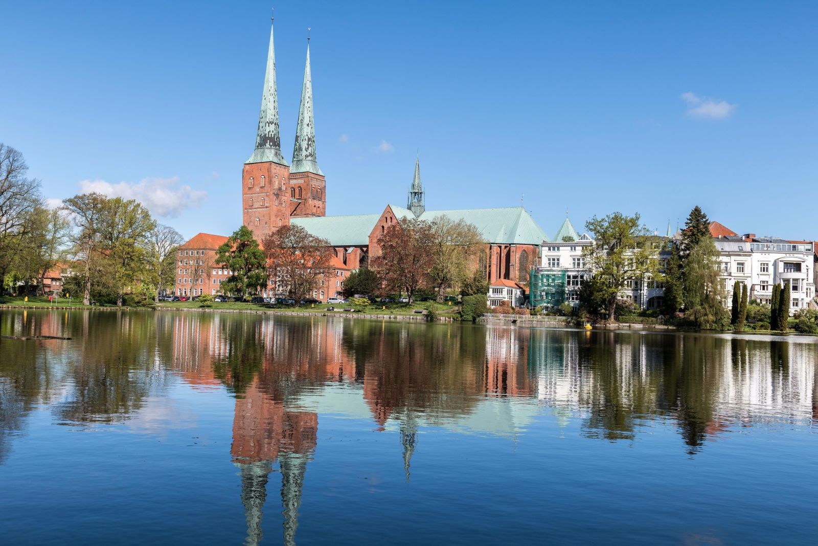 Lübeck Cathedral and old-town buildings reflected in water