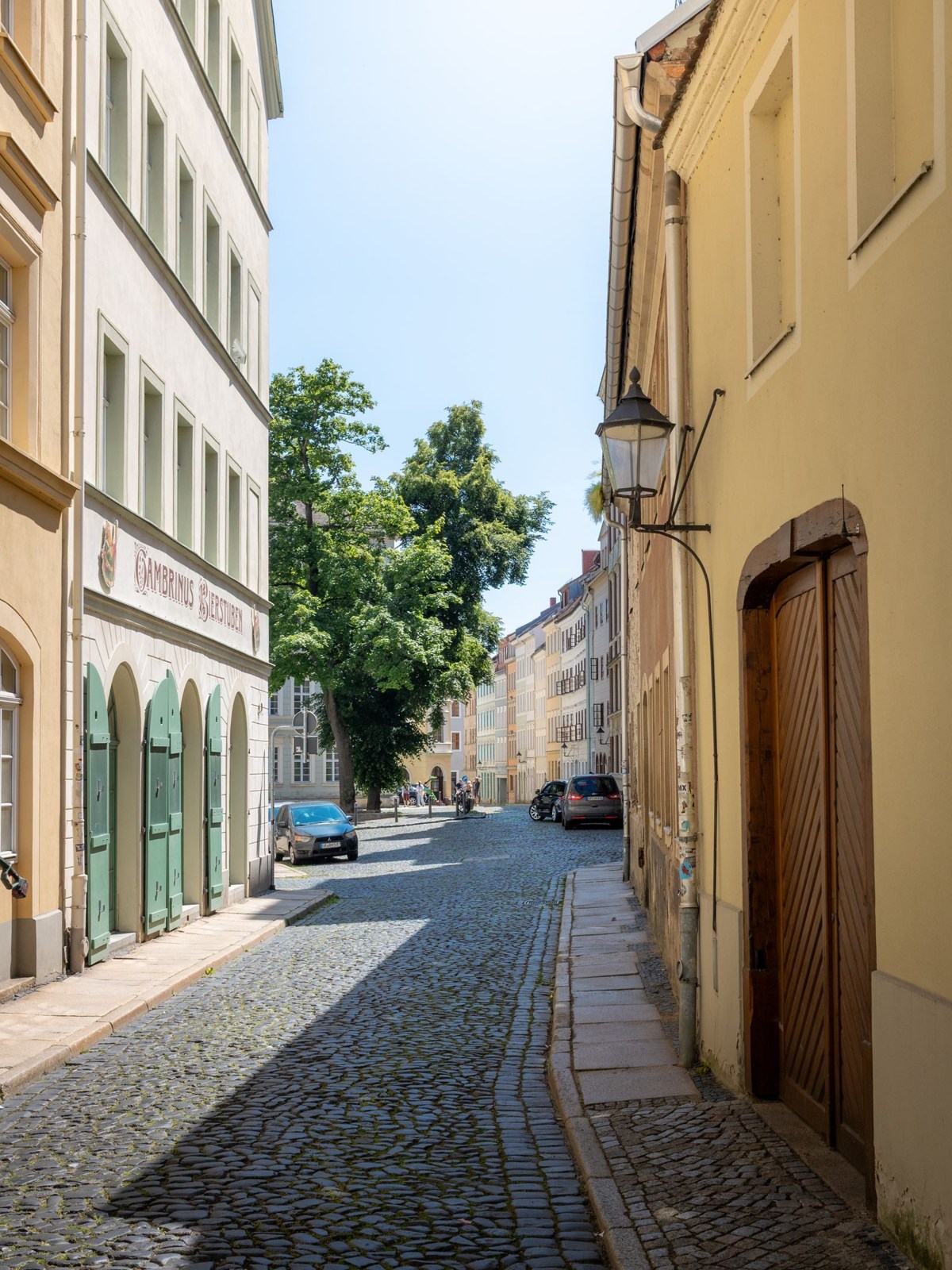 Cobbled street lined with historic facades in Görlitz