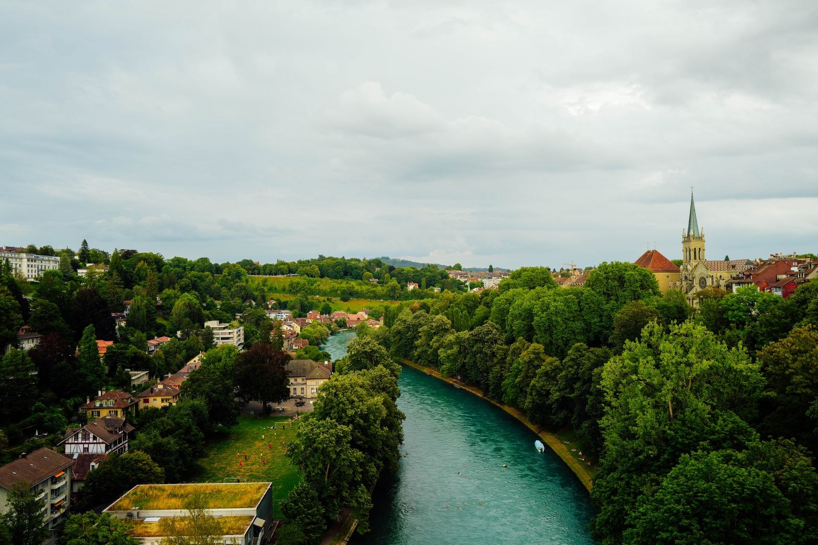 The Aare between green banks and buildings in Bern