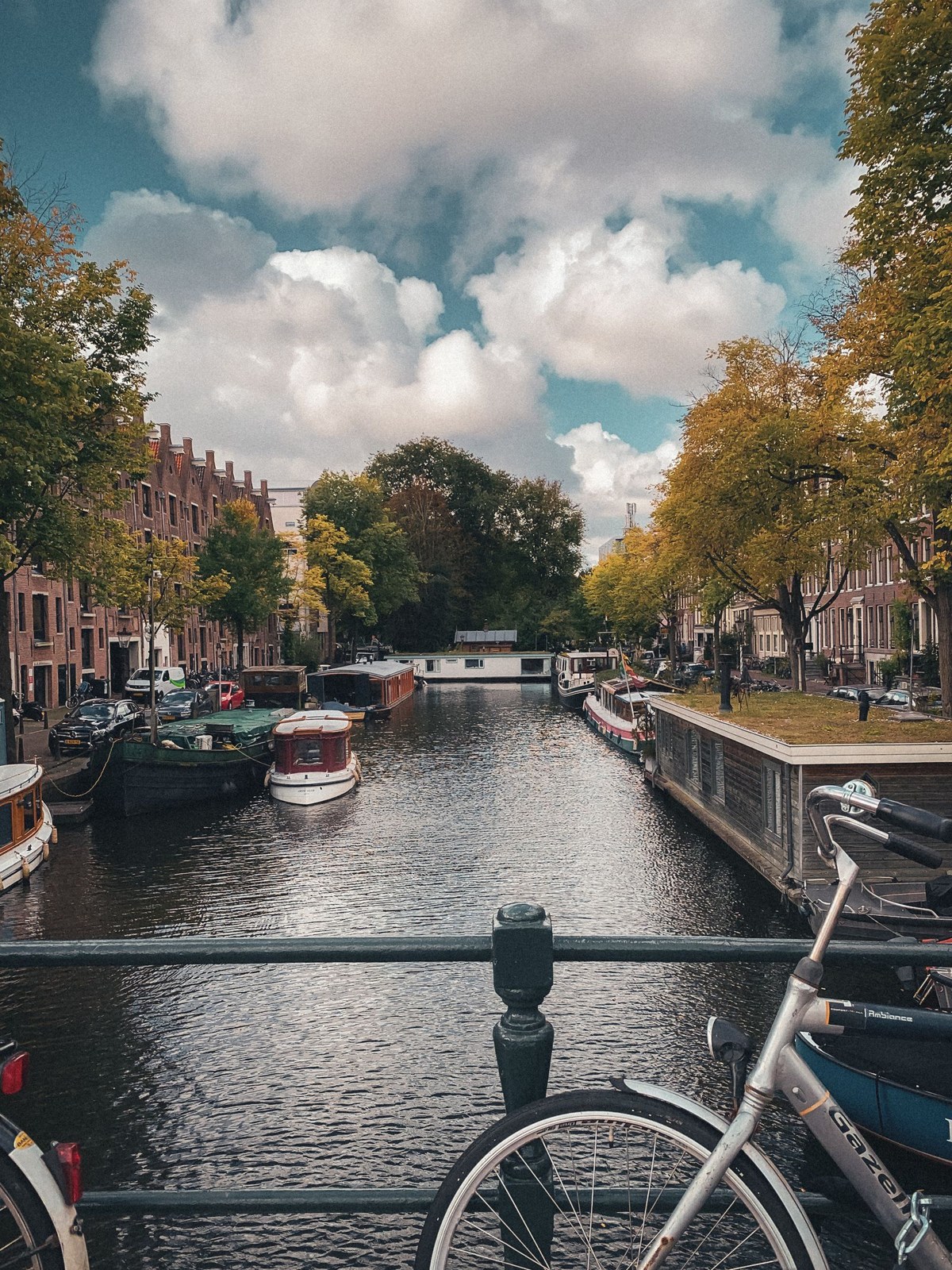 Canal with boats and bicycles in Amsterdam