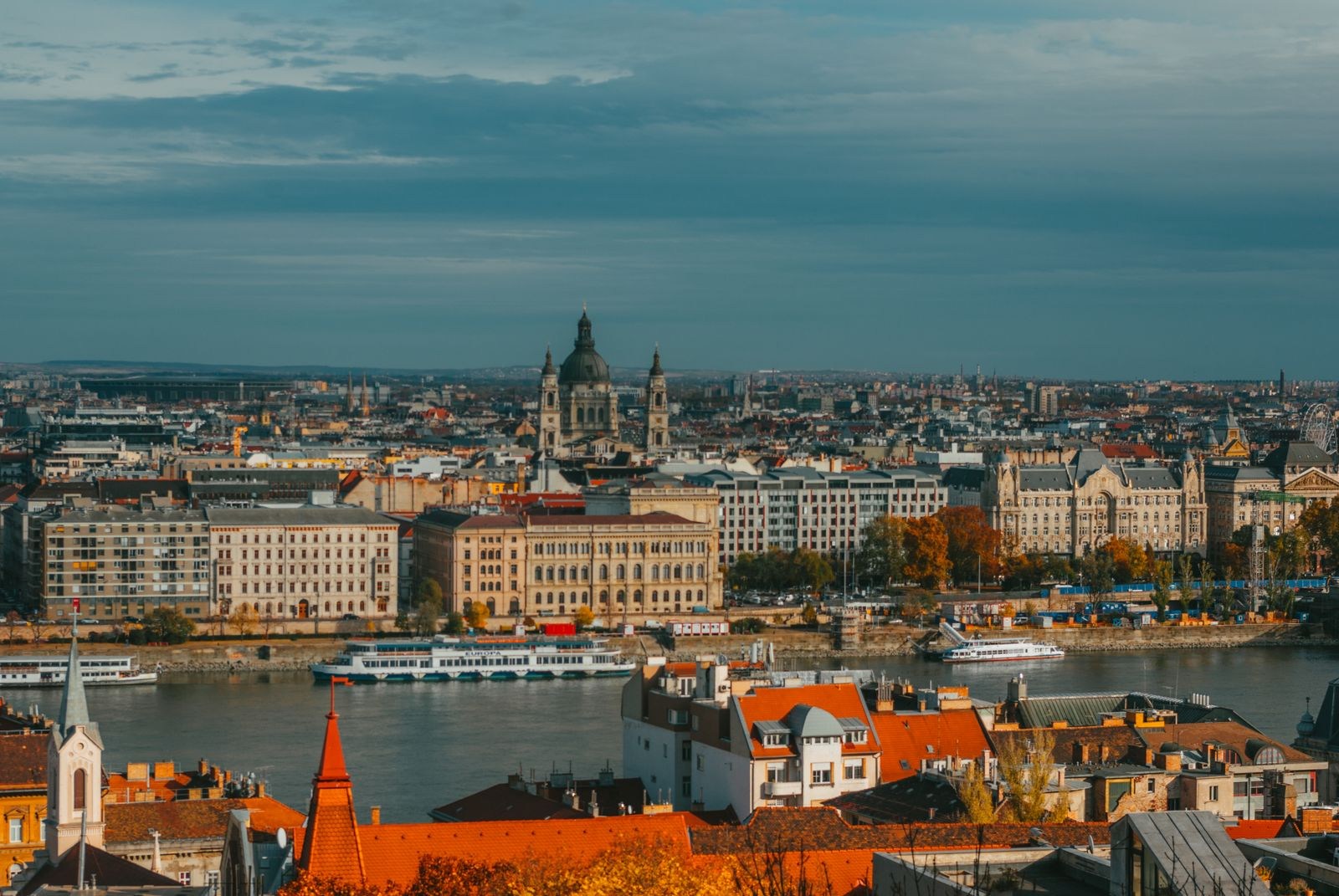 Budapest buildings along the Danube beneath a cloudy sky
