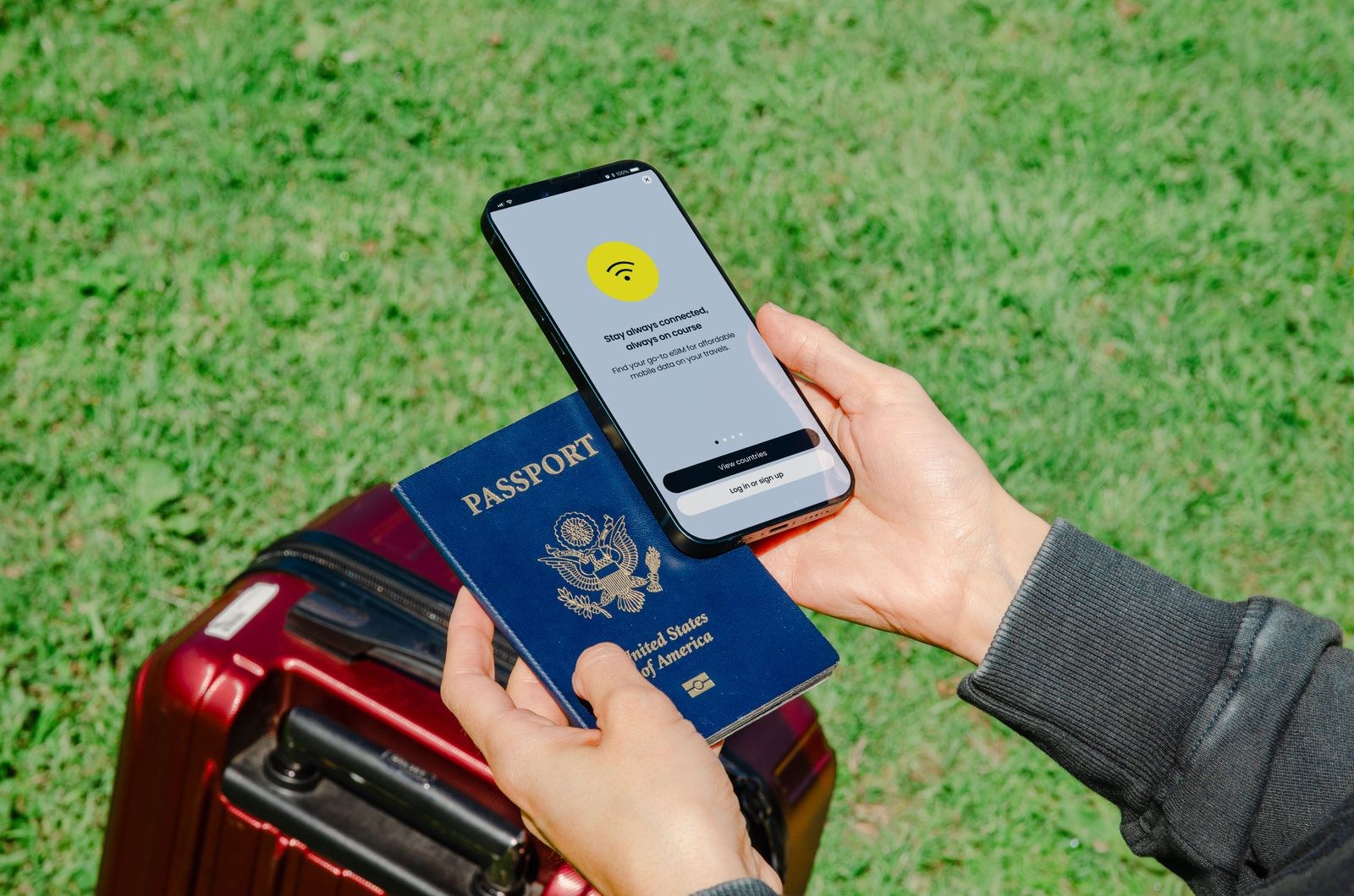 Passport and smartphone showing a connection notice above a suitcase