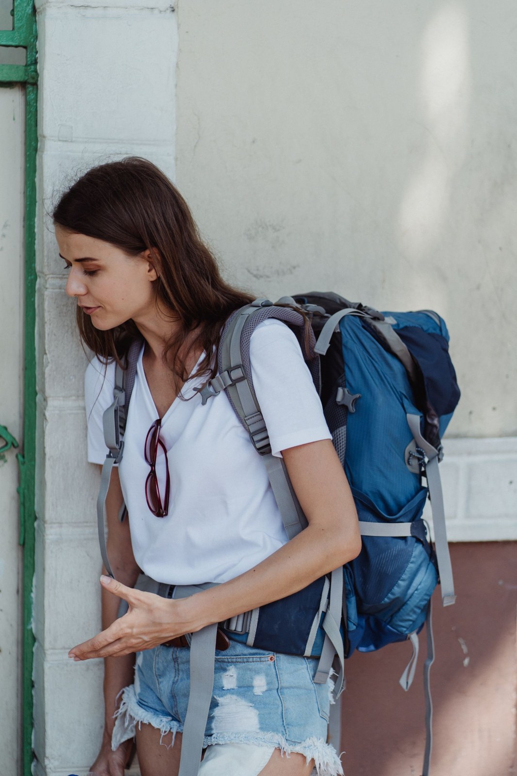 Traveler carrying a large backpack outdoors