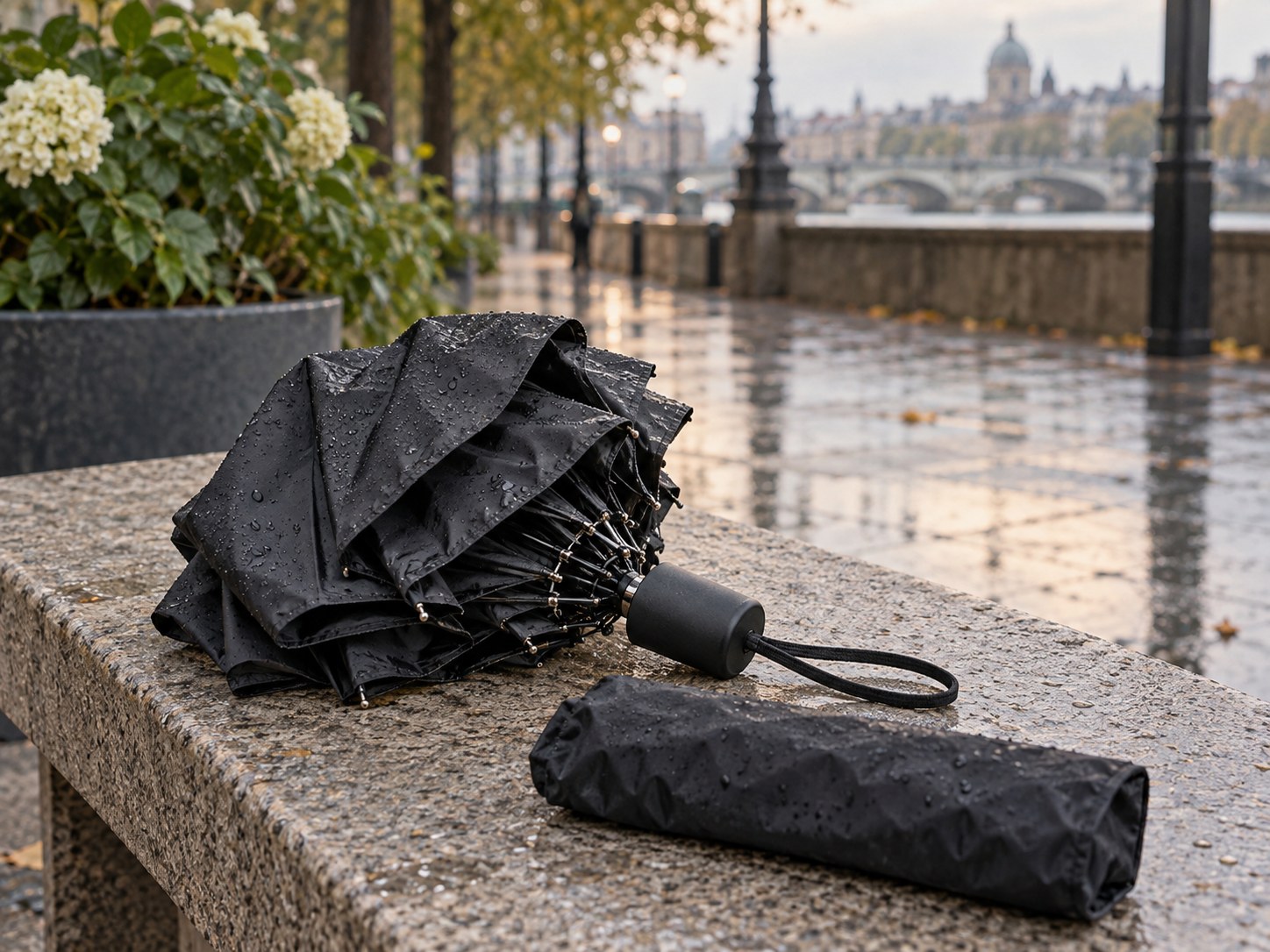 Folding umbrella and its sleeve on a bench